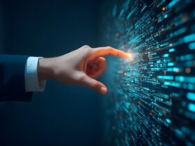 Businessperson's hand in a suit reaches toward a glowing wall of code in a high-tech display.