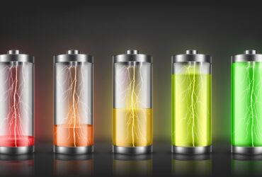 Row of five batteries showing increasing charge from red to green, with electric sparks inside each cell.