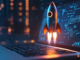 Rocket launching from a laptop keyboard into a blue digital backdrop, symbolizing startup tech growth.