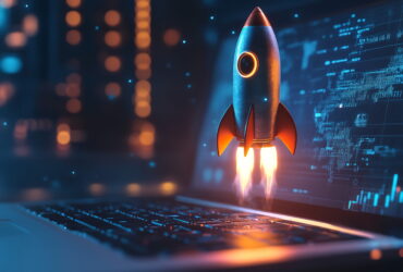 Rocket launching from a laptop keyboard into a blue digital backdrop, symbolizing startup tech growth.