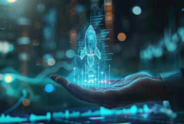 Holographic rocket projection hovering above an open hand in a blue-lit high-tech setting.